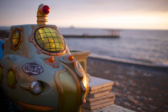 In this photo taken on Thursday, Nov. 28, 2013, a submarine from an amusement arcade is on the beach in central Sochi, Russia.
