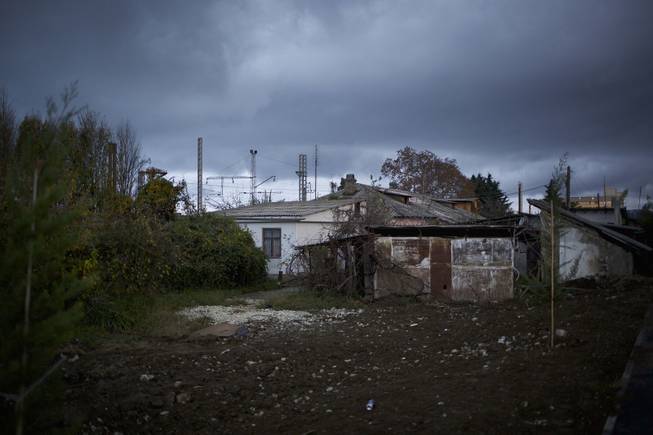 In this photo taken on Wednesday, Nov. 27, 2013,  the 5a street Akatsiy's house is in the village of Vesyoloye outside Sochi, Russia.