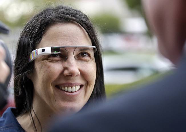 Cecilia Abadie wears her Google Glass as she talks with her attorney outside of traffic court in this Dec. 3, 2013, file photo taken in San Diego.