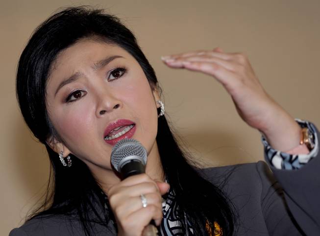 In this Jan. 17, 2014 file photo, Thai Prime Minister Yingluck Shinawatra gestures as she answers questions during an interview with the foreign media at the office of Permanent Secretary for Defense on the outskirts of Bangkok, Thailand.