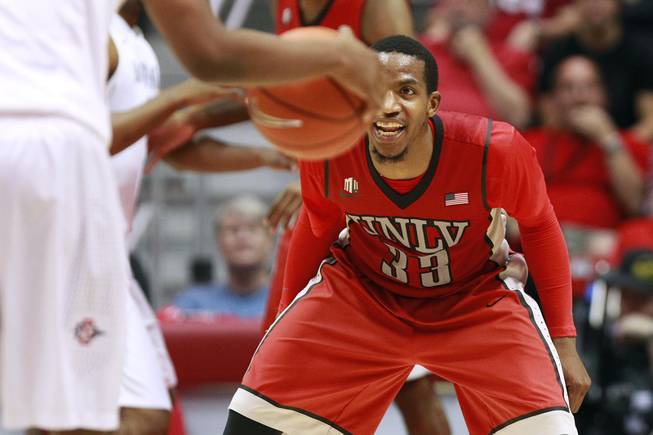 UNLV guard Deville Smith gets set to defend San Diego State during their game Saturday, Jan. 18, 2014, at Viejas Arena in San Diego. The 10th-ranked SDSU won the game 63-52.