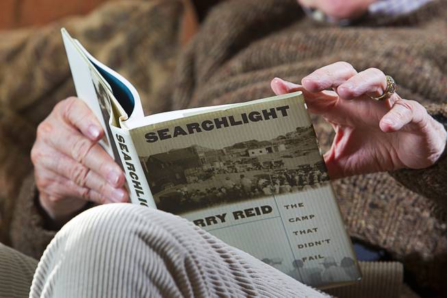 Senate Majority Leader Harry Reid (D-NV) reads from his book on Searchlight, Nev. during an interview at his home in Searchlight Monday Jan. 20, 2014.