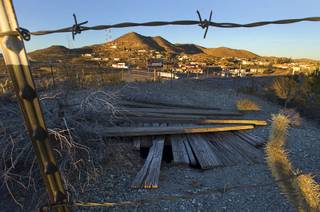An old mining shaft is shown on a hill in Searchlight, Nev. Monday Jan. 20, 2014.