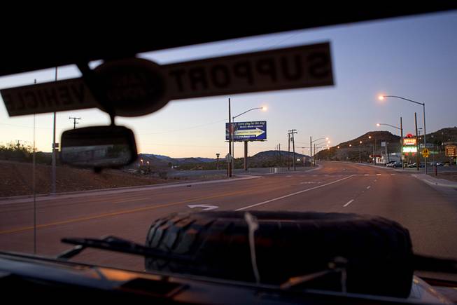 A view of Searchlight, Nev. is seen through the windshield of the "Finding Nevada" Land Rover Monday Jan. 20, 2014.