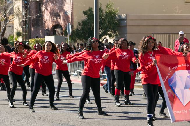 Members of the Delta Gems dance for the crowd during the 32nd Annual Dr. Martin Luther King Jr. Parade, Monday Jan. 20, 2014.