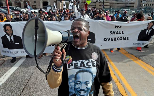 William Whittaker sparks up the crowd with a chant of "We are the Marchers," during the March of Celebration honoring the Rev. Martin Luther King Jr. and his fight for equality on Monday, Jan. 20, 2014, in St. Louis. "I have been the voice of the march for the last 28 years. I still believe in the dream," said Whittaker. 