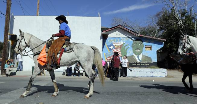 Horse riders take part in a march honoring Martin Luther King Jr., Monday,  Jan. 20, 2014, in San Antonio.  Parades and celebrations have been scheduled across Texas to honor Martin Luther King Jr. on the federal holiday in his name. 