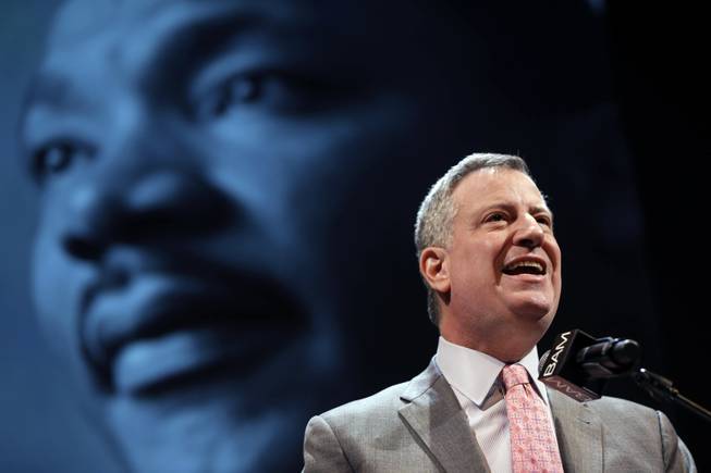 New York City Mayor Bill de Blasio speaks at a tribute to Martin Luther King, Jr. in the Brooklyn borough of New York, Monday, Jan. 20, 2014. De Blasio told a packed audience Monday at the Brooklyn Academy of Music that the "price of inequality has deepened." 