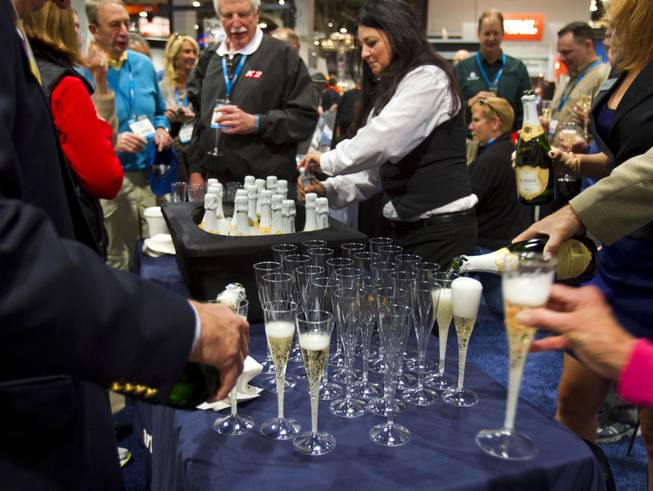 Champagne is poured as Concrete Openings Magazine gives out show awards during the 40th anniversary of the World Of Concrete at the Las Vegas Convention Center on Wednesday, Jan. 22, 2014.