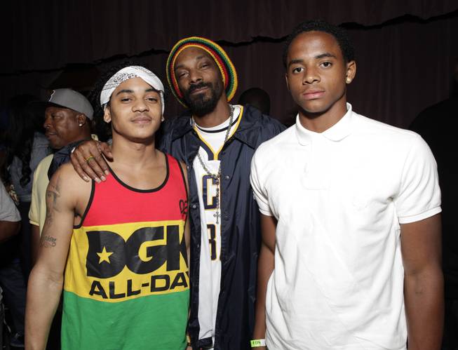 Snoop Dogg with his sons Corde Broadus, left, and Cordell Broadus, right, arrive at the Mac and Devin Go to High School DVD Preview featuring Snoop Dogg and Wiz Khalifa on Monday, June 11, 2012, in Los Angeles. 