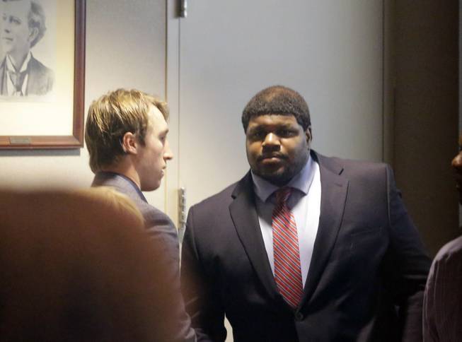 Former Dallas Cowboys player Josh Brent, right, stands with Dallas Cowboys linebacker Sean Lee in court after closing arguments in his intoxication manslaughter trial Tuesday, Jan. 21, 2014, in Dallas.
