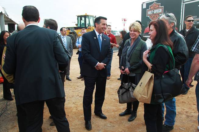 Governor Brian Sandoval talks with guests at an event to mark the beginning of construction of a Harley Davidson dealership on the Strip Thursday, Jan. 23, 2014. The dealership will be located on the east side of the Strip, just south of Russell Road.