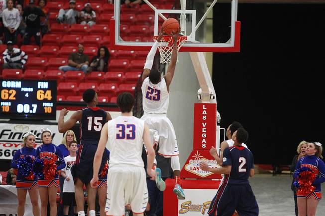 Bishop Gorman forward Nick Blair drops in the game-tying basket to send their game against Findlay Prep into overtime Saturday, Jan. 25, 2014 at the South Point. Gorman won 76-72.