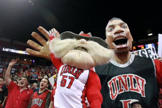 Hey Reb and Khem Kong try to distract a Fresno State free-throw attempt during their game Saturday, Jan. 25, 2014, at the Thomas & Mack Center. UNLV won 75-73 in overtime.