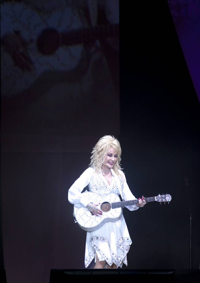Dolly Parton performs “Jolene” during her “Blue Smoke World Tour” stop at Star of the Desert Arena in Buffalo Bill’s on Saturday, Jan. 25, 2014, in Primm.