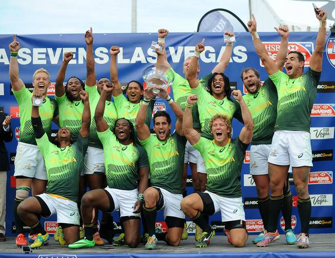 The Springboks of South Africa celebrate after defeating the All Blacks and 7's of New Zealand in the Cup Final of the USA 7's Rugby tournament 14-7 for their second consecutive finals win at Sam Boyd Stadium on Sunday afternoon.