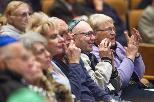 Members of the congregation applaud Ret. Major Leonard Berney at Congregation Ner Tamid in Henderson Monday, Jan. 27, 2014. Berney was a member of British forces that liberated the Bergen-Belsen concentration camp during Word War II. The presentation was part of International Holocaust Memorial Day.