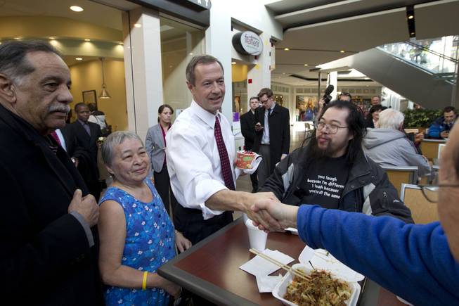 Maryland Gov. Martin O'Malley shakes hands with customers at the Mall in Columbia, Md, after the mall was reopened to the public on Monday, Jan. 27, 2014.