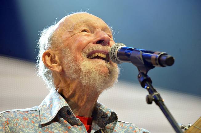 Pete Seeger performs at the Farm Aid 2013 concert at Saratoga Performing Arts Center in Saratoga Springs, N.Y., Sept. 21, 2013. The American troubadour, folk singer and activist Seeger died Monday, Jan. 27, 2014, at age 94. 