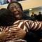 Photo: Charita Grant, left, holds Karey Pierre, right, wh
