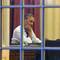 Photo: President Barack Obama works at his desk in the Ov