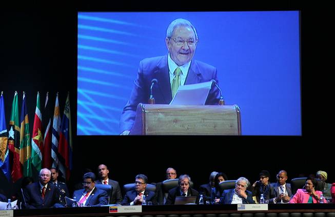 A large screen shows Cuba's President Raul Castro speaking at the opening ceremony of the CELAC Summit in Havana, Cuba, Tuesday, Jan. 28, 2014. 