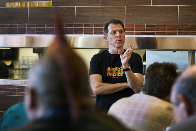 Chef Bobby Flay talks after the ribbon-cutting ceremony of his Bobby’s Burger Palace on Wednesday, Jan. 29, 2014, on the Strip in Las Vegas.