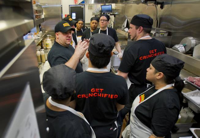 Director of Operations Michael Kuhns briefs his kitchen staff as they ready to prepare lunch for guests after the ribbon-cutting ceremony of chef Bobby Flay’s Bobby’s Burger Palace on Wednesday, Jan. 29, 2014, on the Strip in Las Vegas.