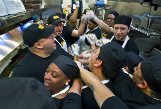 Director of Operations Michael Kuhns with his kitchen staff as they prepare lunch for invited guests after the ribbon-cutting ceremony of chef Bobby Flay’s Bobby’s Burger Palace on Wednesday, Jan. 29, 2014, on the Strip in Las Vegas.