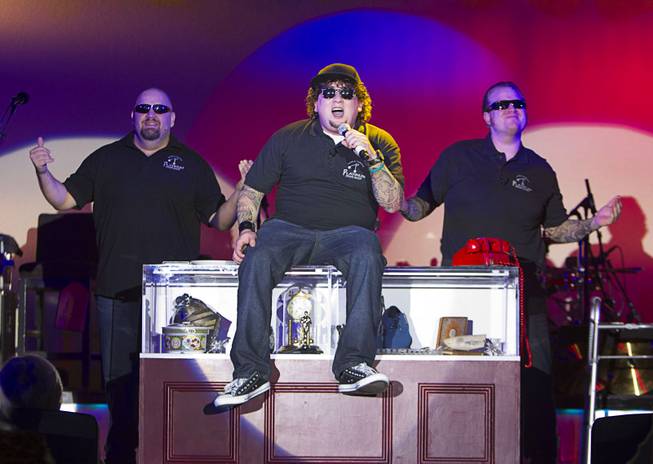 Slick Garrison (Sean Critchfield), left, Chump (Garrett Grant), center, and Lil' Boss (Gus Langley) perform during "Pawn Shop Live!" at the Golden Nugget Thursday, Jan. 30, 2014. The production show is a parody based on the story of Gold & Silver Pawn, home of the History Channel's Pawn Stars television series.