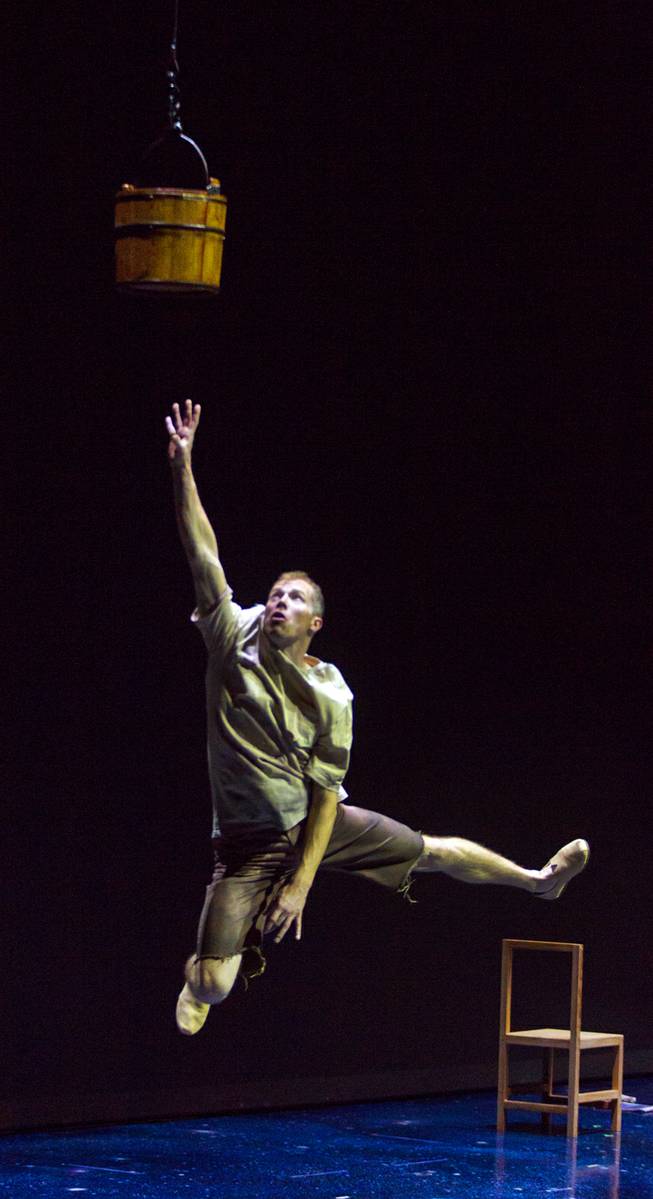 Benedikt Negro as The Seeker leaps for a bucket of water during rehearsal at Michael Jackson Theater on Thursday, Jan. 30, 2014, for this year's “One Night for One Drop” fundraising performance at Mandalay Bay.