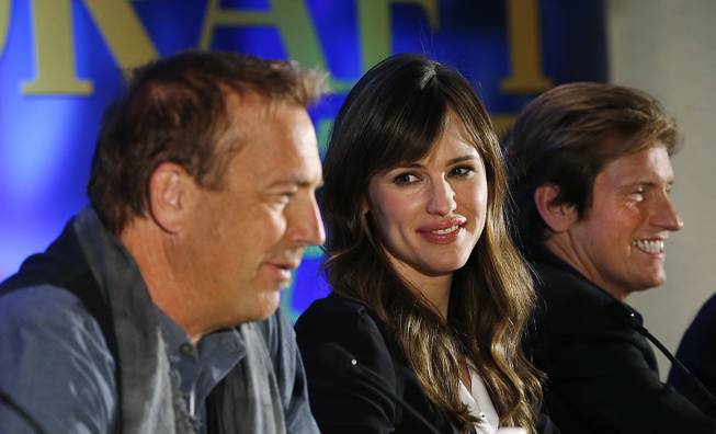 Actors, from left, Kevin Costner, Jennifer Garner and Denis Leary appear at a news conference for the movie "Draft Day" in New York on Friday, Jan. 31, 2014.