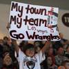Las Vegas Wranglers fan Emily Adams, 10, holds up a sign she made in support of the home team as they faced off against the Ontario Reign on Friday night at the Orleans Arena.