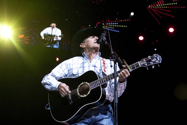 George Strait performs during his “The Cowboy Rides Away Tour” stop at MGM Grand Garden Arena on Saturday, Feb. 1, 2014.