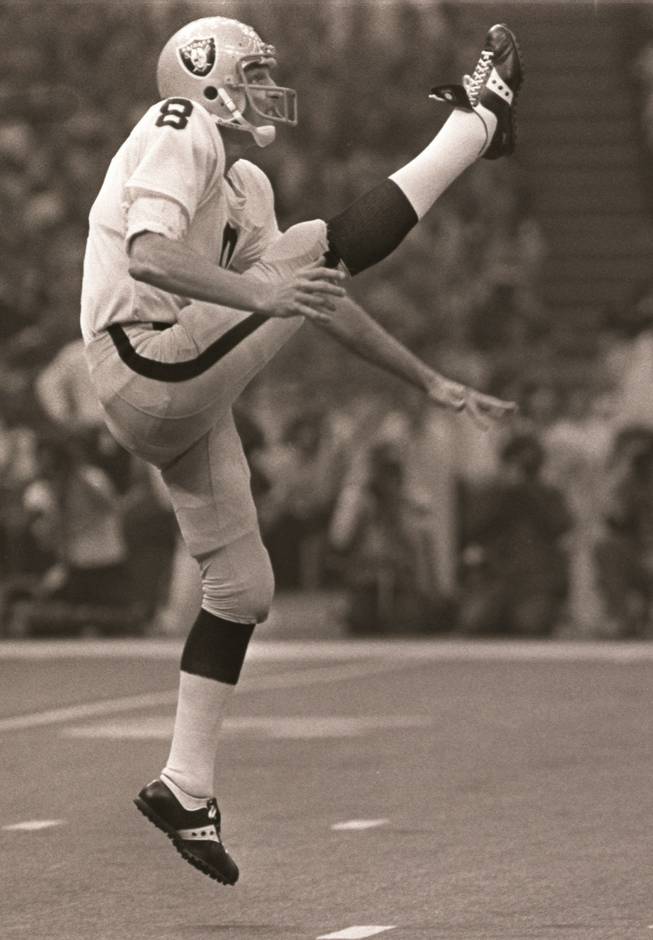 In this Jan. 25, 1981, file photo, Oakland Raiders punter Ray Guy kicks during the Super Bowl in New Orleans. Guy has become the first punter elected to the Pro Football Hall of Fame on Saturday Feb. 1, 2014. 