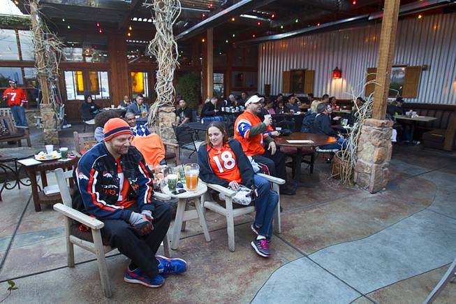 Denver Broncos fans watch Super Bowl XLVIII from an outdoor patio at the Roadrunner Saloon, 9820 W. Flamingo Rd., Sunday, Feb. 2, 2014.