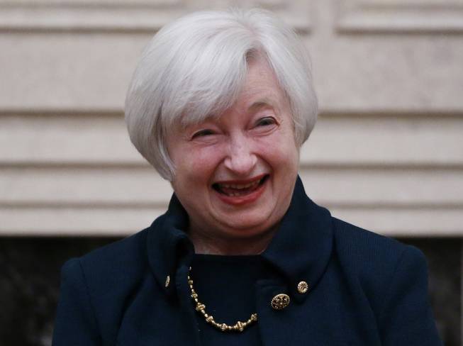 Janet Yellen reacts to applause by staff members after she was sworn in as Federal Reserve Board chair, Monday, Feb. 3, 2014, at the Federal Reserve in Washington. Yellen is the first woman to lead the Federal Reserve.