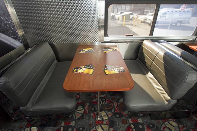 A view of a seating in a lounge car during a tour of X Train Club cars Tuesday, Feb. 4, 2014.