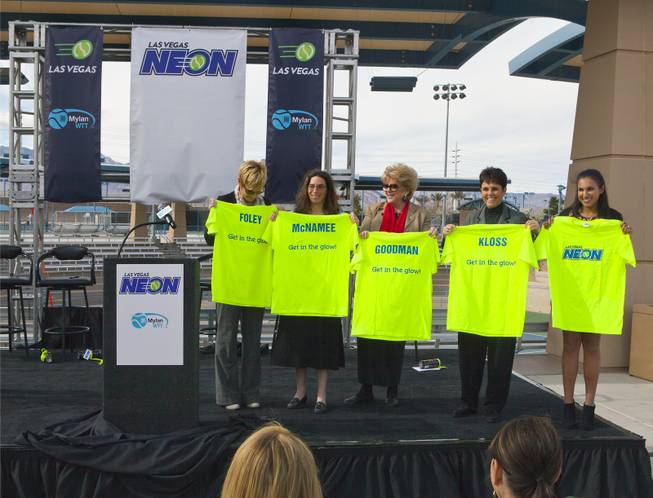 (center) Las Vegas Mayor Carolyn G. Goodman joins others on stage with custom t-shirts following a press conference at the Darling Tennis Center to announce the Las Vegas Neon of the Mylan World Team Tennis on Tuesday, Feb. 04, 2014.
