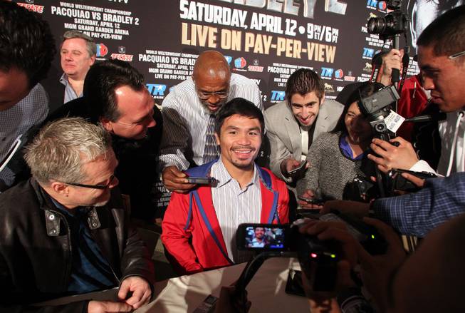 Feb.  4, 2014, Beverly Hills ,Ca.   ---   Manny Pacquiao talks to reporters during the press conference  in Beverly Hills to announce his upcoming rematch against undefeated WBO World Welterweight  champion Timothy Bradley during a two-city media tour in Los Angeles on Tuesday and New York on Thursday.  Pacquiao vs. Bradley 2 will take place, Saturday, April 12 at the MGM Grand Garden Arena in Las Vegas. Chris Farina - Top Rank