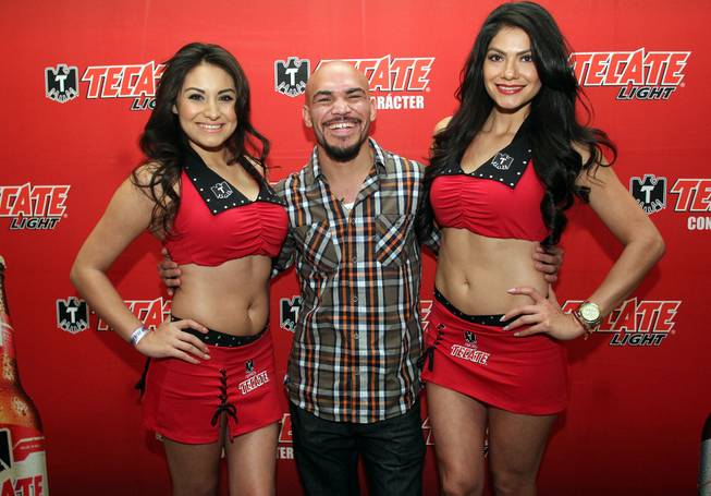 Feb.  4, 2014, Beverly Hills ,Ca.   ---  World-ranked Lightweight Ray Beltran poses with the Tecate girls during the press conference in Beverly Hills to announce his upcoming battle with former world champion Roman "Rocky" Martinez on the undercard of Manny Pacquiao vs Timothy Bradley. Pacquiao vs. Bradley 2 will take place, Saturday, April 12 at the MGM Grand Garden Arena in Las Vegas. Chris Farina - Top Rank