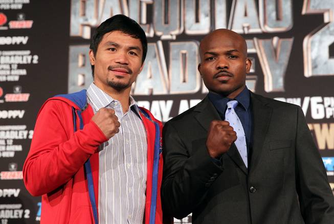 Feb.  4, 2014, Beverly Hills ,Ca.   ---  Manny Pacquiao, left, and undefeated WBO World Welterweight  champion Timothy Bradley pose during the press conference  in Beverly Hills to announce their upcoming rematch during a two-city media tour in Los Angeles on Tuesday and New York on Thursday.  Pacquiao vs. Bradley 2 will take place, Saturday, April 12 at the MGM Grand Garden Arena in Las Vegas. Chris Farina - Top Rank