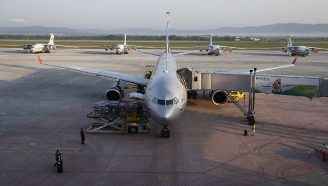 An Aeroflot Airbus parks in front of older Russian-made planes at the terminal in Vladivostok airport in Vladivostok, Russia, Tuesday, Sept. 11, 2012.