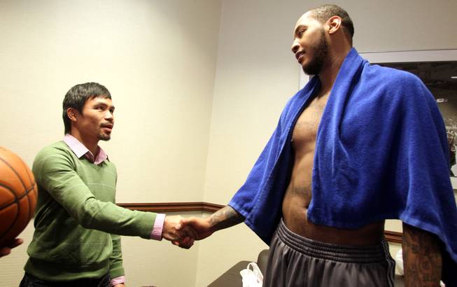 Feb.  5, 2014, New York,NY   ---   Manny Pacquiao meets New York Knicks forward Carmelo Anthony (R) in the locker room after the  New York Knicks - Portland Trail Blazers NBA basketball game at Madison Square Garden in New York City Wednesday night. Pacquaio was in town as part of a two-city media tour to announce his upcoming rematch against undefeated WBO World Welterweight  champion Timothy Bradley.  Pacquiao vs. Bradley 2 will take place, Saturday, April 12 at the MGM Grand Garden Arena in Las Vegas. Chris Farina - Top Rank