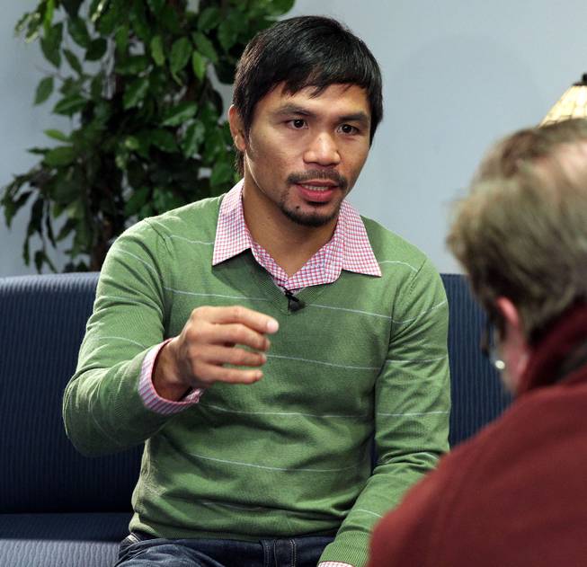 Feb.  5, 2014, New York,NY   ---  "MAKIN' THE ROUNDS" ---  Manny Pacquiao sits down for an interview at Associated Press in New York City Wednesday. Pacquiao is on the second stop of a two-city media tour to announce his upcoming rematch against undefeated WBO World Welterweight  champion Timothy Bradley. Pacquiao vs. Bradley 2 will take place, Saturday, April 12 at the MGM Grand Garden Arena in Las Vegas. Chris Farina - Top Rank