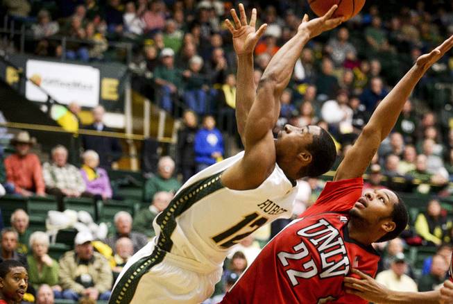 Colorado State's Carlton Hurst shoots as he's fouled by UNLV's Jelan Kendrick (22) on Wednesday, Feb. 5, 2014, at Moby Arena in Fort Collins, Colo. Colorado State won 75-57. 