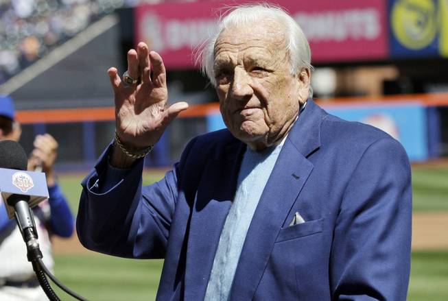 Hall of Famer Ralph Kiner waves to the crowd before announcing the New York Mets starting line-up before an opening-day game against the Atlanta Braves at Citi Field on Thursday, April 5, 2012, in New York.