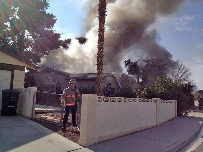 Flames erupted shortly after noon at this home in the 4700 block of El Escorial Drive near Mountain Vista Street and East Flamingo Road, Friday, Feb. 7, 2014.