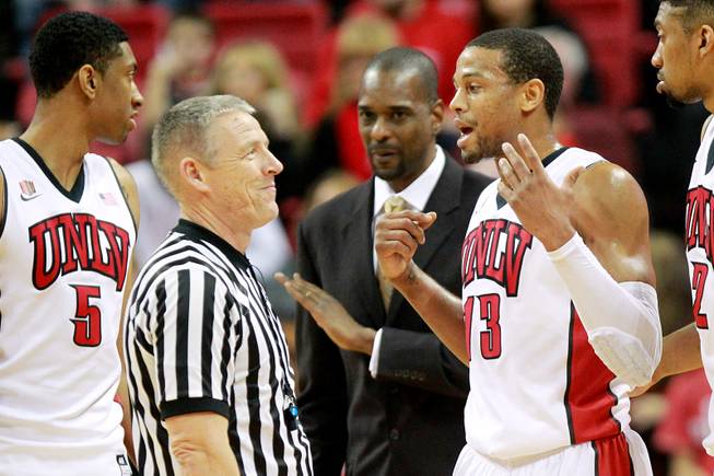 Official Chris Rastatter reacts as UNLV guard Bryce Dejean Jones tries to explain what happened when he was whistled for a technical foul against Wyoming during their game Saturday, Feb. 8, 2014 at the Thomas & Mack Center. UNLV won 48-46.