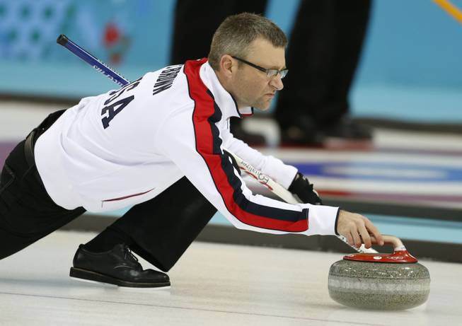 Craig Brown, an alternate on Team USA, delivers the stone during a men's curling training session the 2014 Winter Olympics on Sunday, Feb. 9, 2014, in Sochi, Russia.